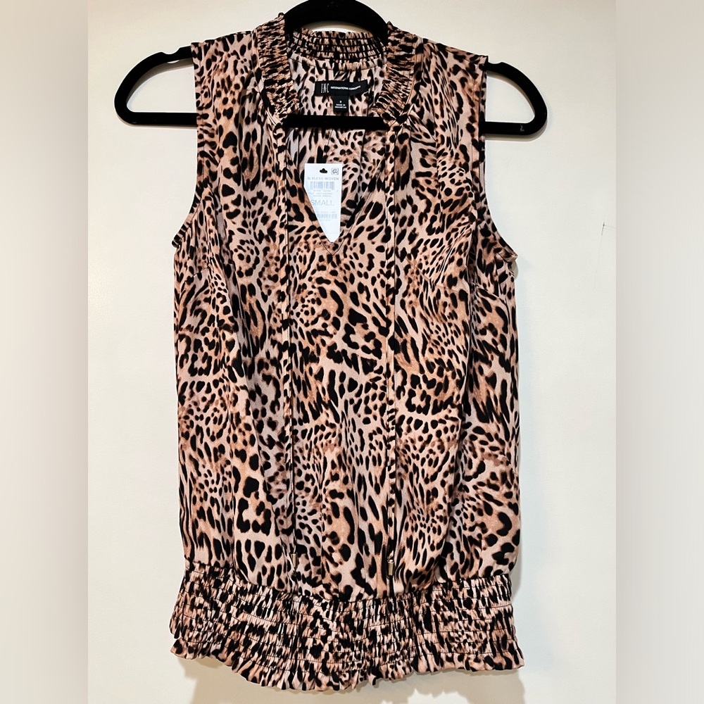 INC sleeveless leopard top.